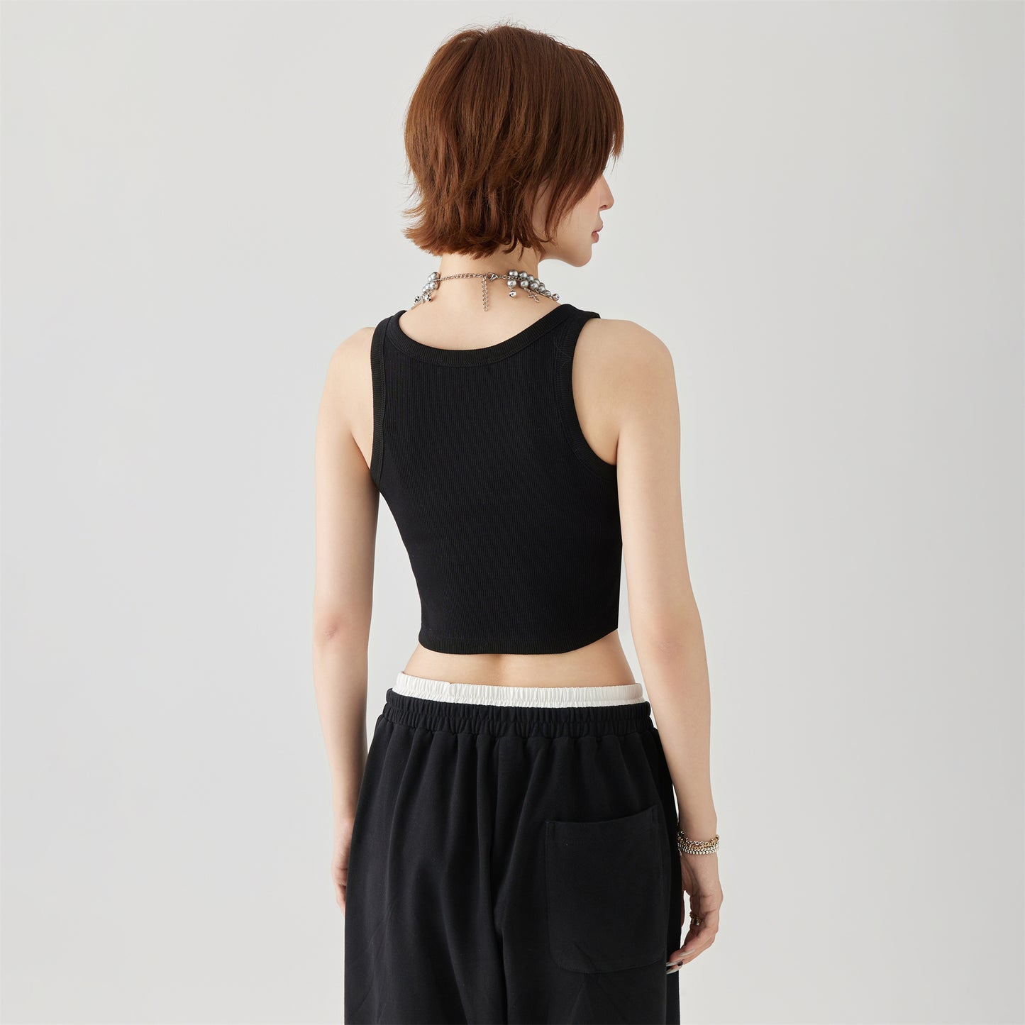 Golfkrossning asosiy modellari kashtado'zlikni yaxshi ko'radi tashqi kiyim yengsiz kamzulga kalta shirin salqin uslubdagi achchiq qizning pastki ichki qismi yuqori yelek ayollar