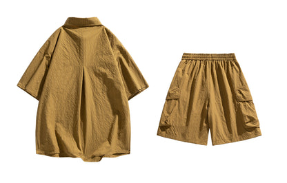 Paddy Julia yaponcha oddiy kundalik qatnovchi to‘liq kelishgan oddiy bo‘shashgan o‘rtacha tekis rangli galstukli yelkali tugmachali bel kalta yengli shortilar bir xil modeldagi erkaklar va ayollar uchun kundalik sport kostyumi