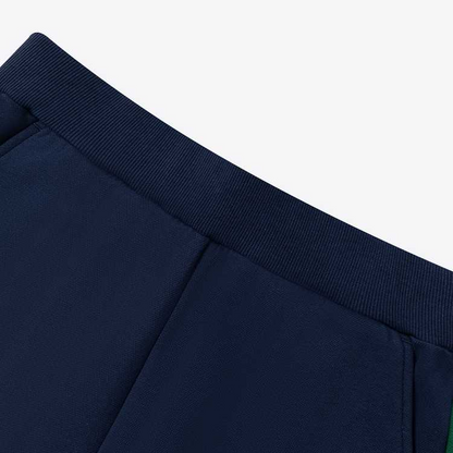 To'q ko'k rangli ayollar uchun Le coq sportif yumshoq teriga mos trikotaj shim.