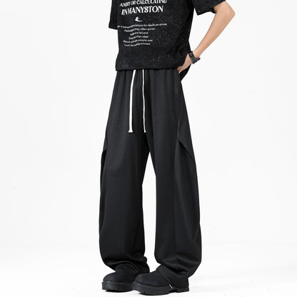 Paddy Julia sof rangdagi plili dekonstruksiyalangan birlashma keng oyoqli Amerika minimalist uslubidagi asosiy bo'lim bo'sh drape tasodifiy ko'p qirrali kundalik ishton erkaklar va ayollar bir xil uslubda