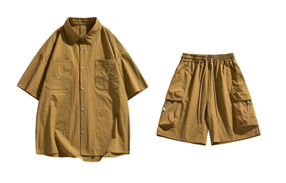 Paddy Julia yaponcha oddiy kundalik qatnovchi to‘liq kelishgan oddiy bo‘shashgan o‘rtacha tekis rangli galstukli yelkali tugmachali bel kalta yengli shortilar bir xil modeldagi erkaklar va ayollar uchun kundalik sport kostyumi