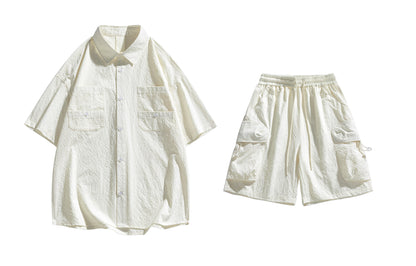 Paddy Julia yaponcha oddiy kundalik qatnovchi to‘liq kelishgan oddiy bo‘shashgan o‘rtacha tekis rangli galstukli yelkali tugmachali bel kalta yengli shortilar bir xil modeldagi erkaklar va ayollar uchun kundalik sport kostyumi