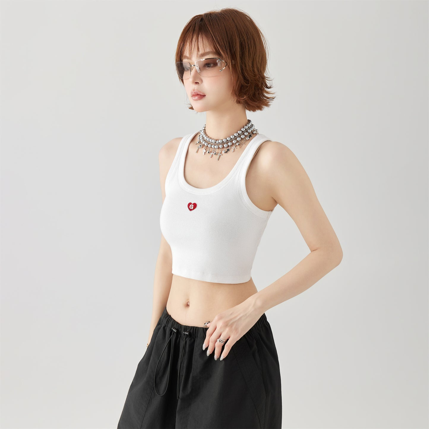 Golfkrossning asosiy modellari kashtado'zlikni yaxshi ko'radi tashqi kiyim yengsiz kamzulga kalta shirin salqin uslubdagi achchiq qizning pastki ichki qismi yuqori yelek ayollar