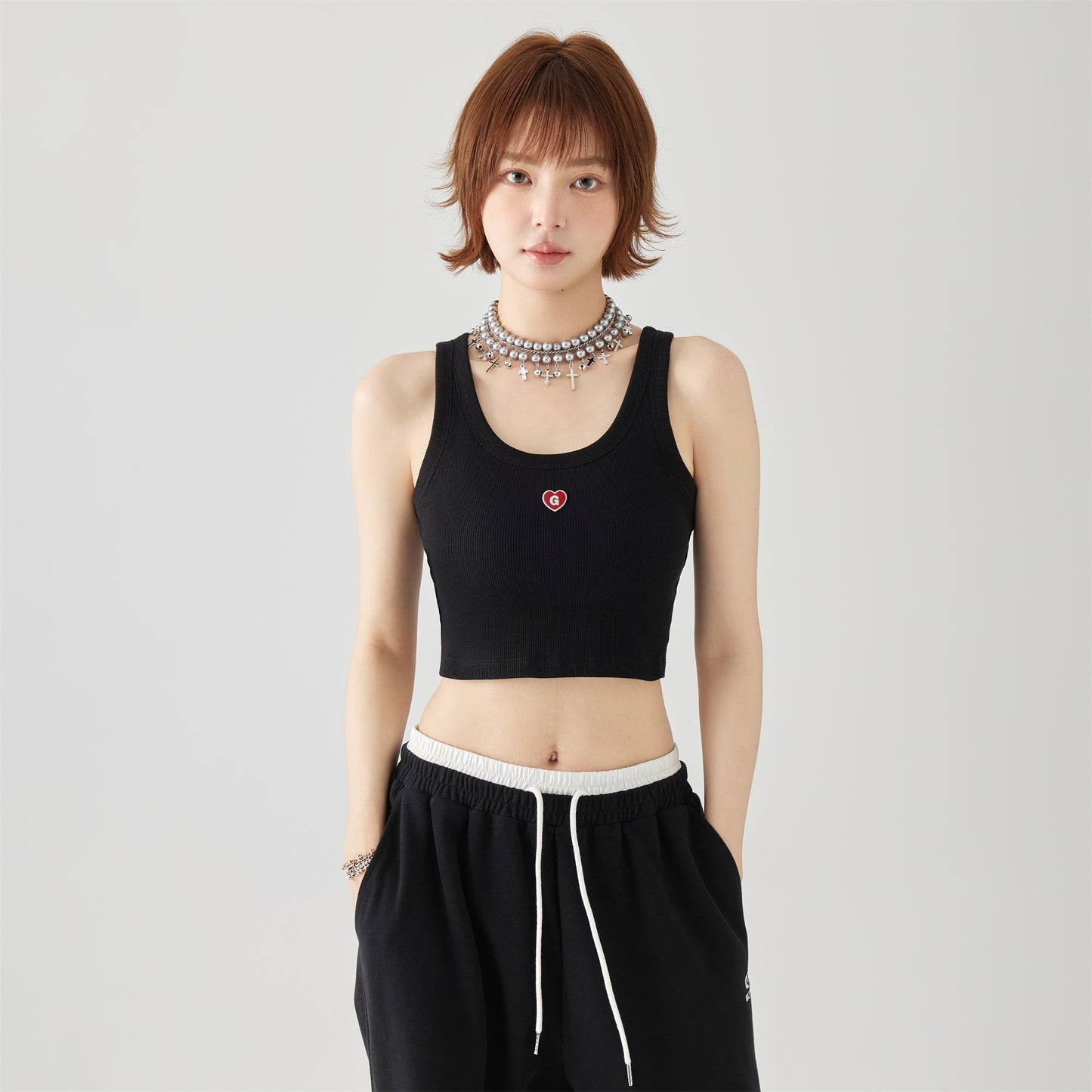 Golfkrossning asosiy modellari kashtado'zlikni yaxshi ko'radi tashqi kiyim yengsiz kamzulga kalta shirin salqin uslubdagi achchiq qizning pastki ichki qismi yuqori yelek ayollar