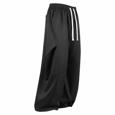 Paddy Julia sof rangdagi plili dekonstruksiyalangan birlashma keng oyoqli Amerika minimalist uslubidagi asosiy bo'lim bo'sh drape tasodifiy ko'p qirrali kundalik ishton erkaklar va ayollar bir xil uslubda