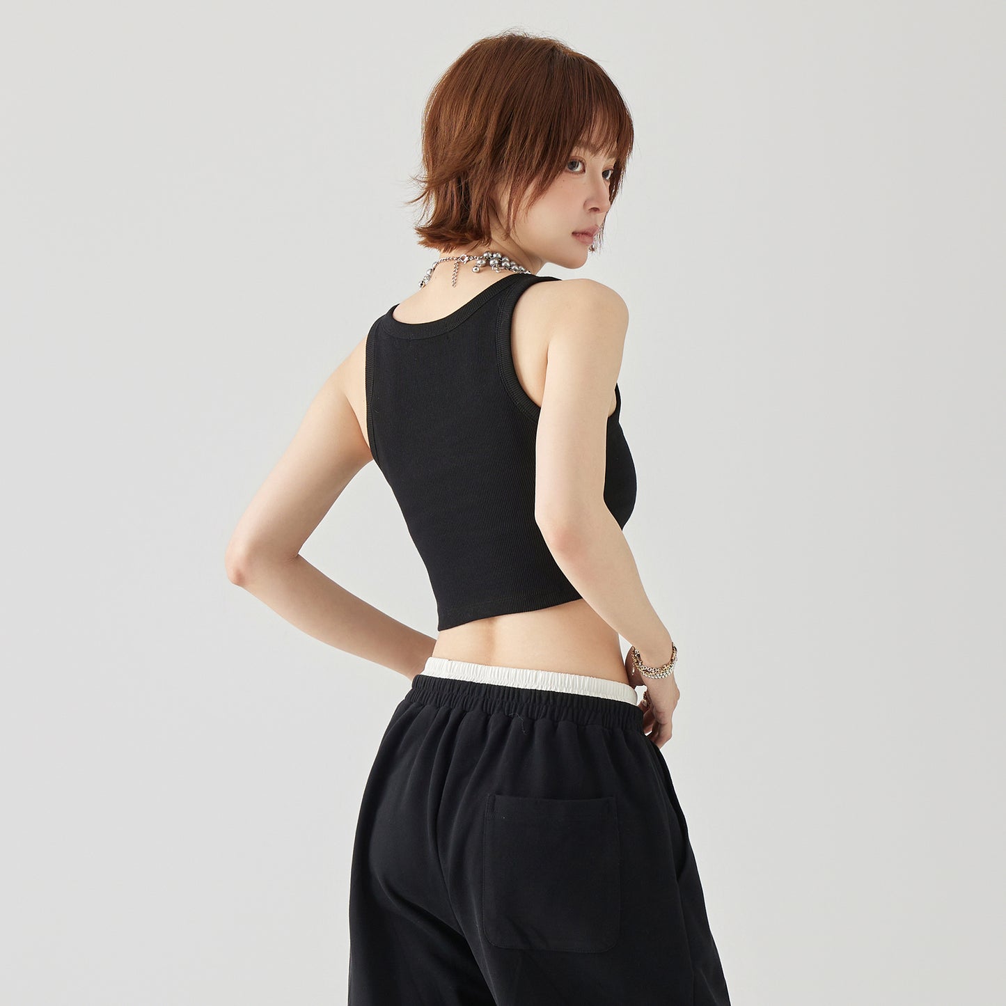 Golfkross asosiy qismi bir tekis tashqi kiyim yengsiz kamzulga qisqa qism shirin salqin shamol achchiq qiz ip ichida yuqori jilet ayol