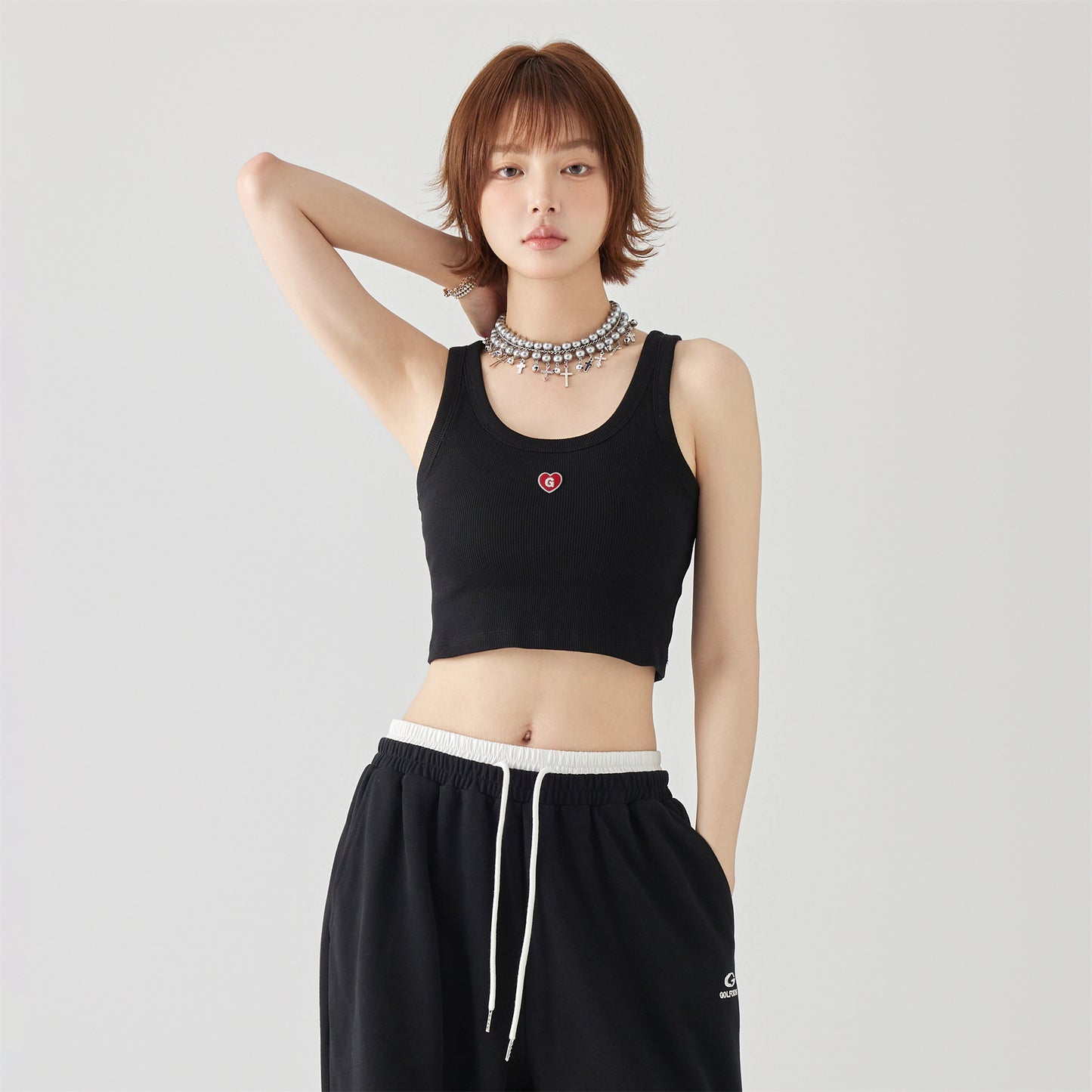 Golfkrossning asosiy modellari kashtado'zlikni yaxshi ko'radi tashqi kiyim yengsiz kamzulga kalta shirin salqin uslubdagi achchiq qizning pastki ichki qismi yuqori yelek ayollar