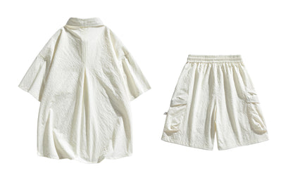 Paddy Julia yaponcha oddiy kundalik qatnovchi to‘liq kelishgan oddiy bo‘shashgan o‘rtacha tekis rangli galstukli yelkali tugmachali bel kalta yengli shortilar bir xil modeldagi erkaklar va ayollar uchun kundalik sport kostyumi