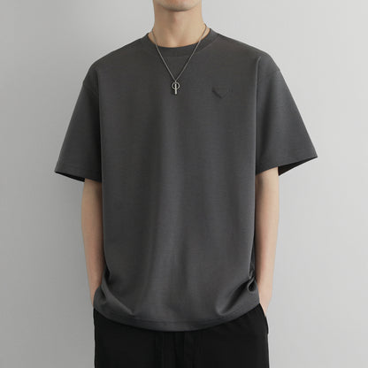 Hvga asosiy modellari eski pul uslubi yumshoq va qulay teri salqin tuyg'u yarim yengli pastki ko'ylak Amerika tekis rangli moda shaxsiyat trendi tasodifiy erkin qisqa qisma futbolkalar bir xil modellar bilan erkaklar va ayollar