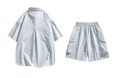 Paddy Julia yaponcha oddiy kundalik qatnovchi to‘liq kelishgan oddiy bo‘shashgan o‘rtacha tekis rangli galstukli yelkali tugmachali bel kalta yengli shortilar bir xil modeldagi erkaklar va ayollar uchun kundalik sport kostyumi