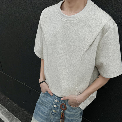 Paddy Julia bir xil rangdagi toza to'rtburchakli yelkali siluet, dekonstruksiya qilingan katta tuyg'usi yumaloq bo'yinli bo'shashgan yelkali ko'p qirrali besh chorak yengli qisqa yengli futbolka bir xil modeldagi erkaklar va ayollar